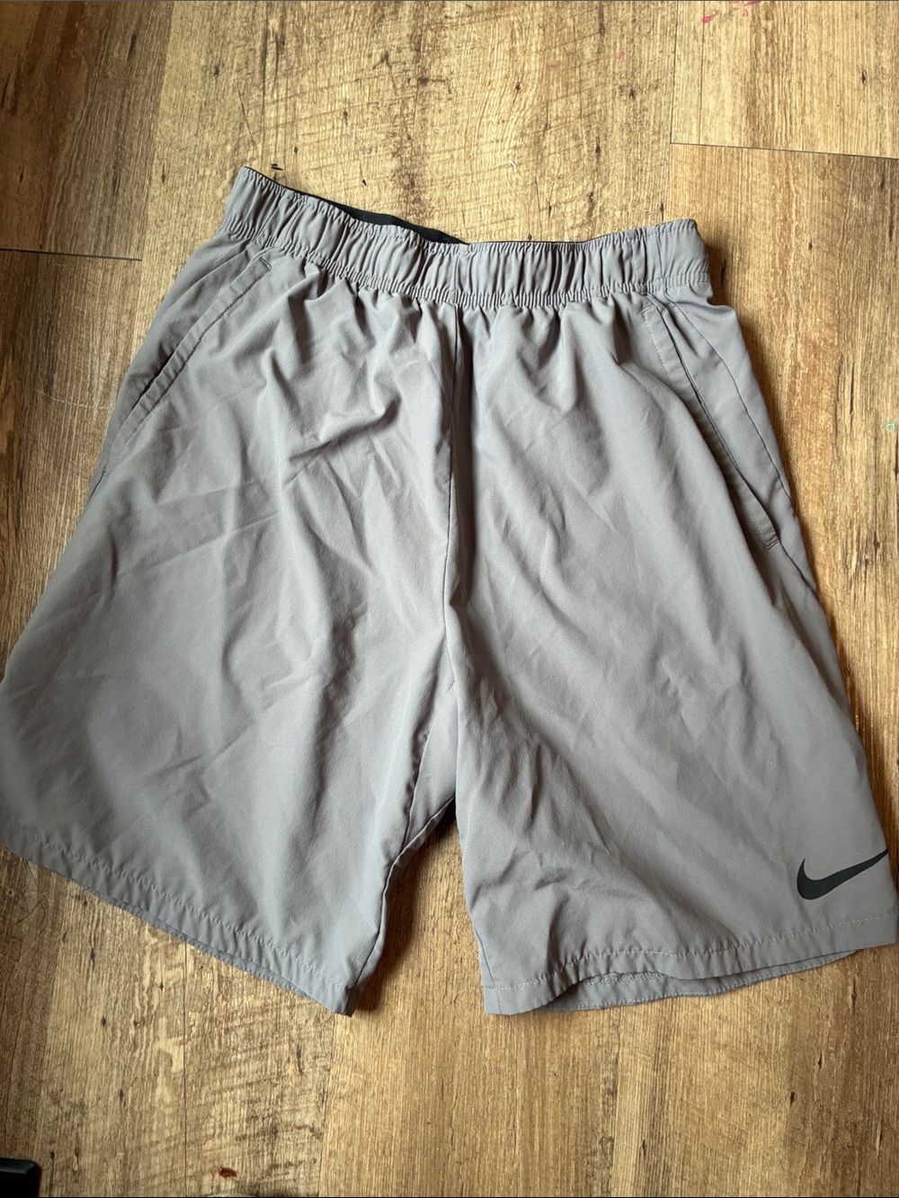 Nike Men’s Light Gray Athletic Shorts with Black Swoosh